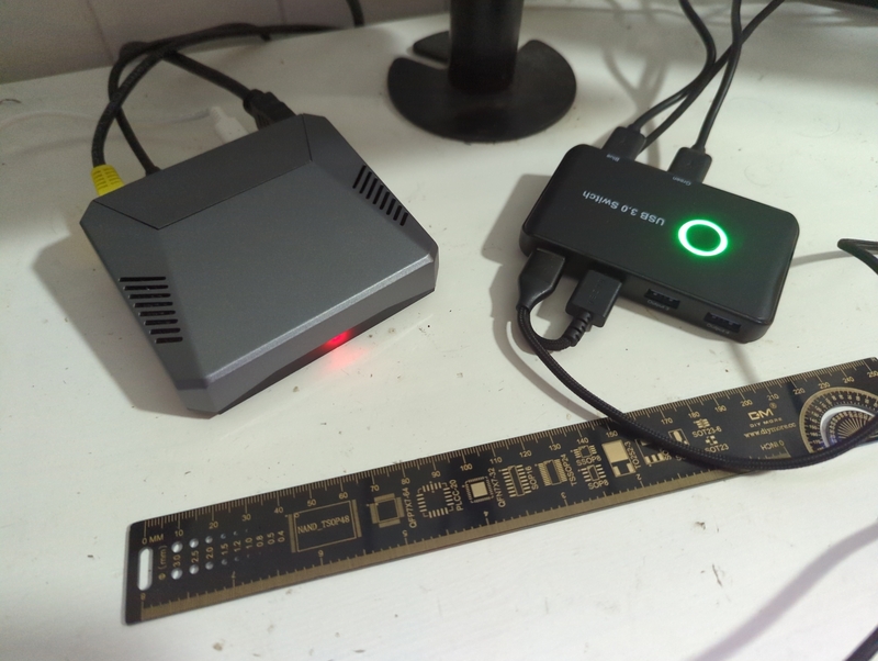 Raspberry Pi 4 in an Argon One case, connected to a USB input switcher