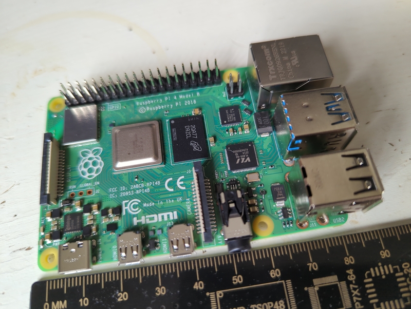 Raspberry Pi 4 board beside a measuring rule