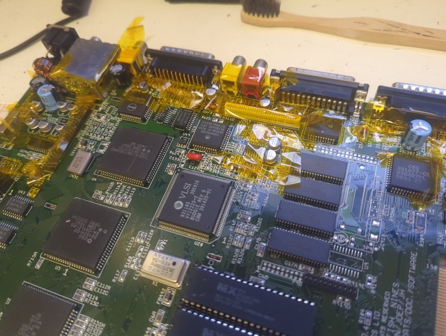 Motherboard wrapped up in Kapton tape